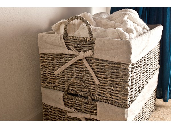 Stack hamper baskets to save space and separate laundry by color or type.