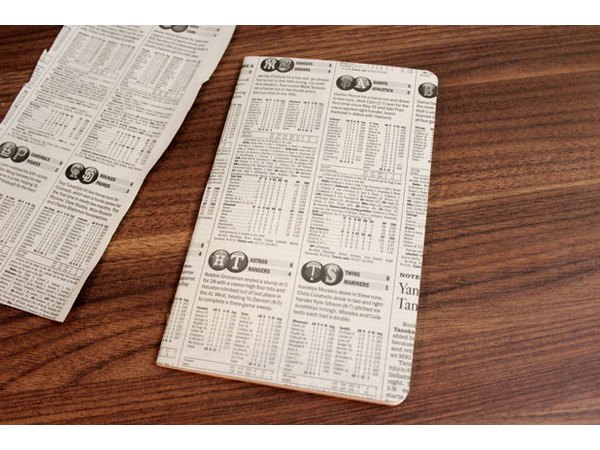 Glue sports section of newspaper to cover