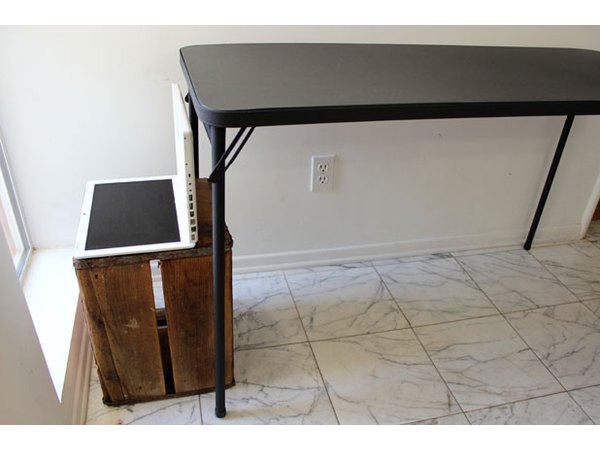 Place a table behind the laptop
