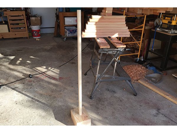 Once sanded, the closet pole should slide easily into the base.
