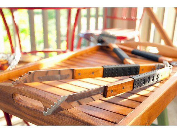 Don't try to balance food on a turner. Move food around the grill with tongs.