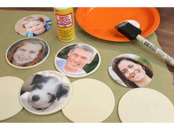 Decoupage photos onto wood discs