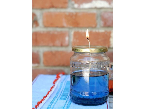 Illuminate your outdoor table with these oil lamp candles.