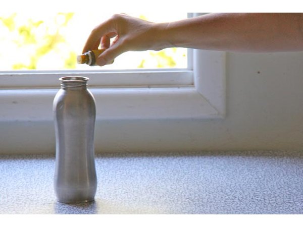 Drop lemon oil in a water bottle to clean it.