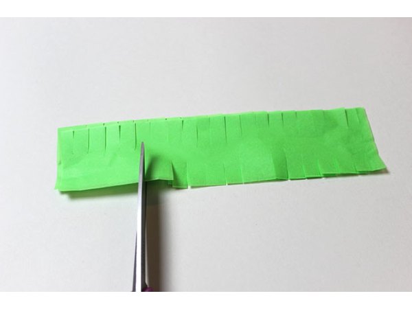 Cut slits along the edges of the narrow strips