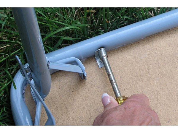 Remove the screws from the table frame.