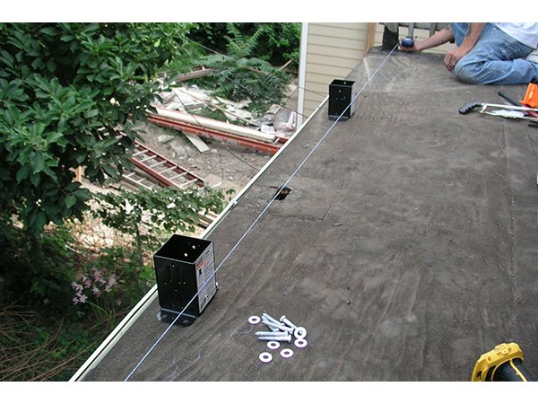 A chalk line keeps the alignment straight.