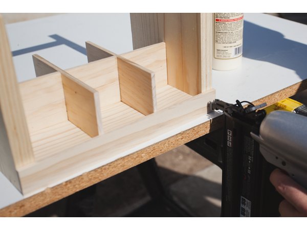 Attaching the wood slats on the outside.