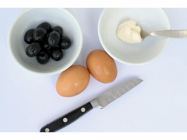 One egg makes two spiders, and you'll need two olives for each.