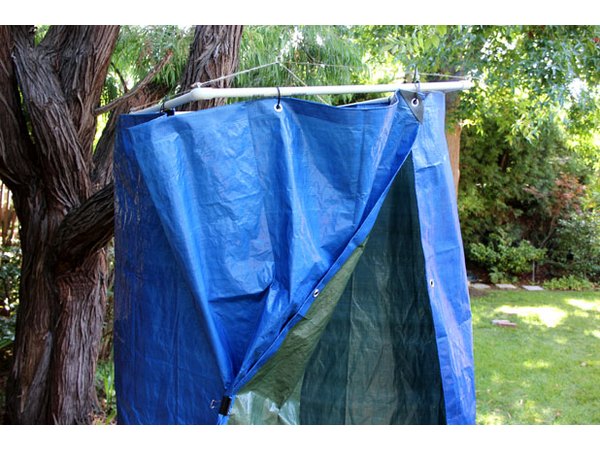 Hang the tarp on the PVC pipe