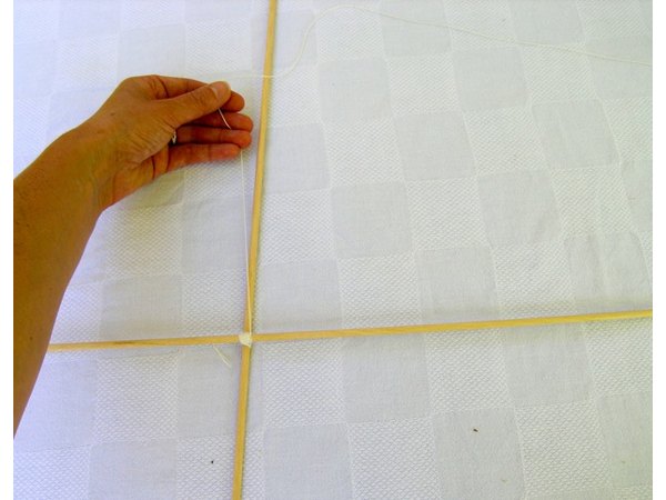 Run string around dowels to make the frame.