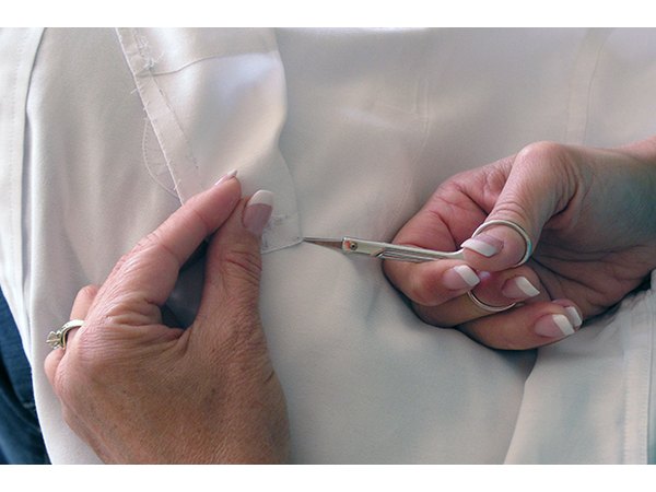 Clip the threads holding the pocket in place.