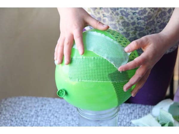 Arrange material strips on balloon