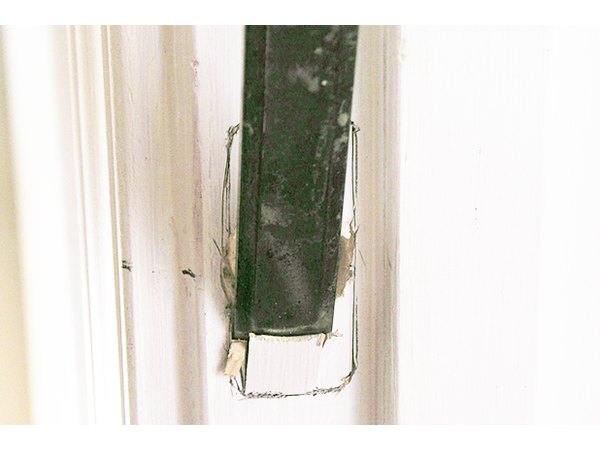 Remove enough wood so that the plate sits level with the doorframe.