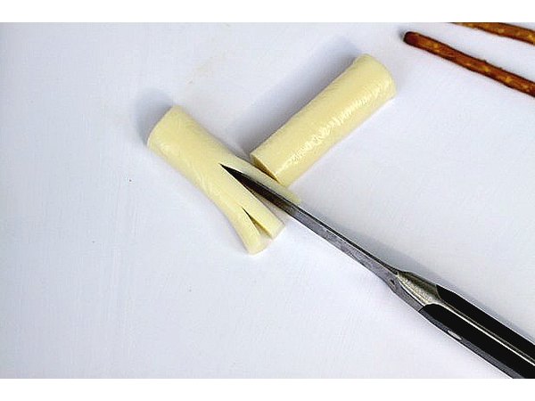 Set the flat side of the cheese on your cutting surface to help steady it.