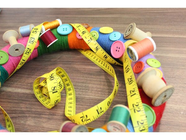 Wrap a tape measure around the wreath