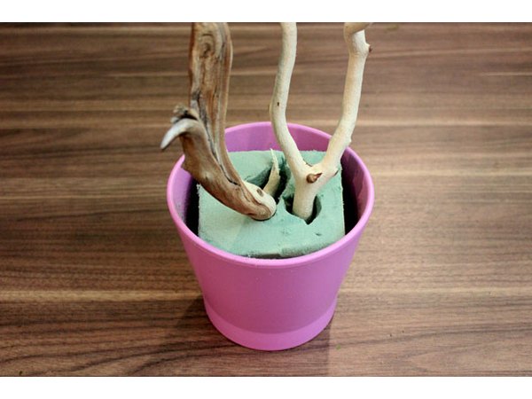 Insert branches in floral foam