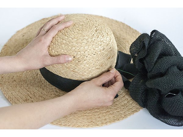 An oversized bow gives the hat volume