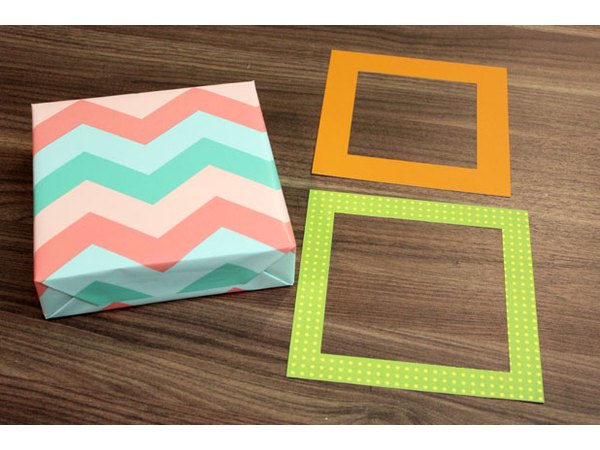 Cut out square windows to fit on the box