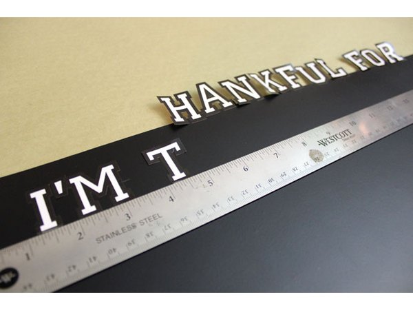 Apply adhesive letters