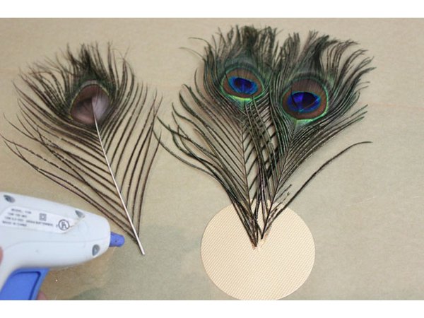 Hot glue feathers to cardstock disk.