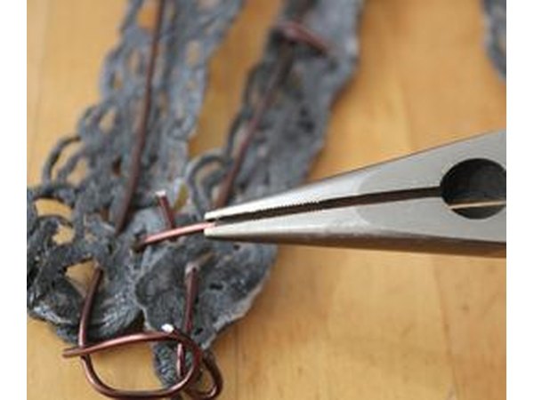 Pinching the wire.