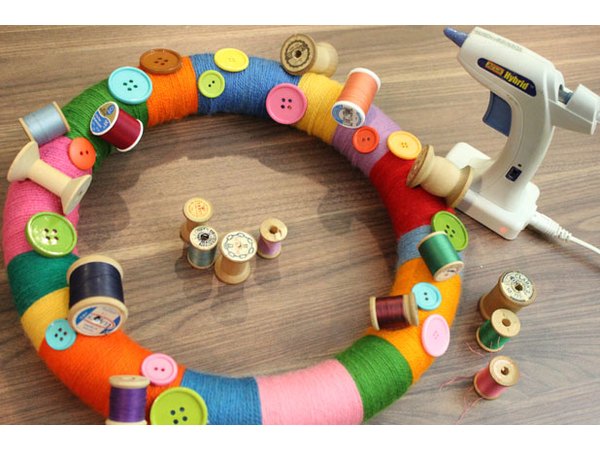 Glue spools of thread to the wreath