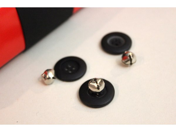 Glue jingle bells to the buttons.