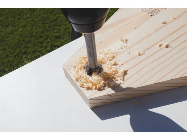 Drilling a ¾" hole for the handle.
