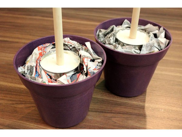 Place cans in decorative planters