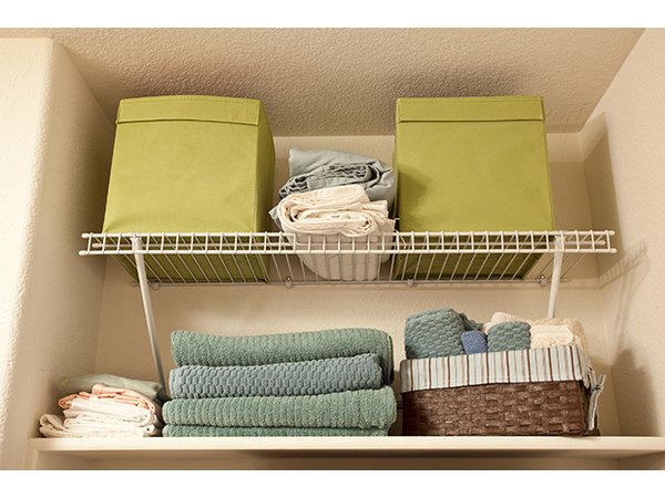 Fill shelves with items right up to the ceiling to maximize your closet storage.