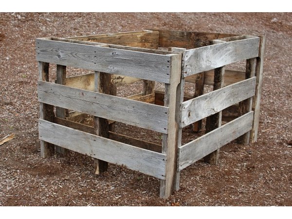 Stand the pallets up to configure the raised bed.