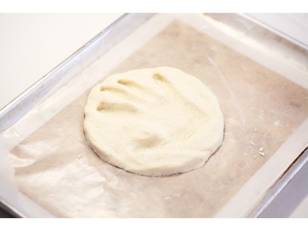 Press your child's hand into the dough.