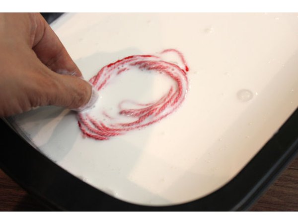 Soak the yarn in the glue mixture