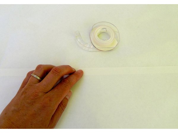 Attach two sheets of freezer paper.