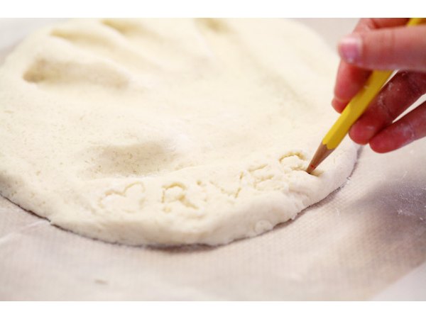 Etch your child's name into the dough.