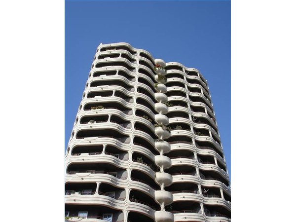 A modern apartment building with balconies in Malaga, Spain.
