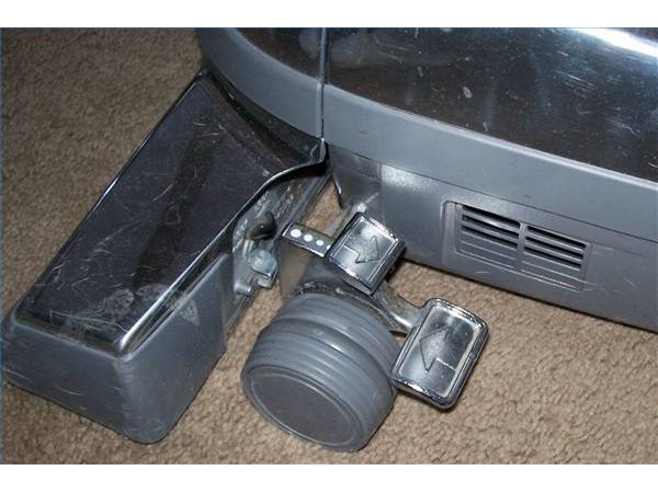 Tap to raise or lower the "business end" of the vacuum.