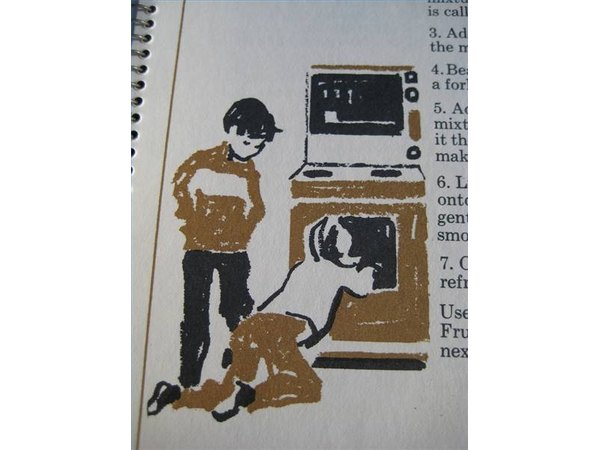Boy and girl at gas oven