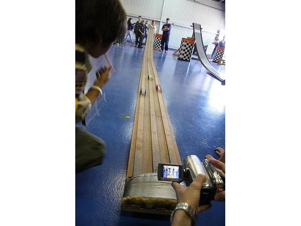 Pinewood derby race track with three lanes.