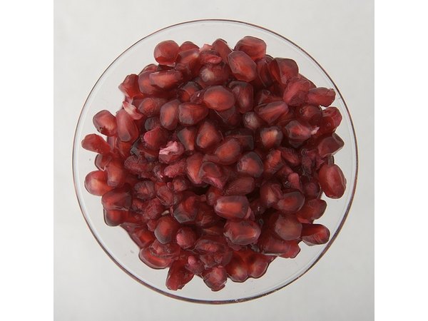 Arils are juice sacs surrounding pomegranate seeds.
