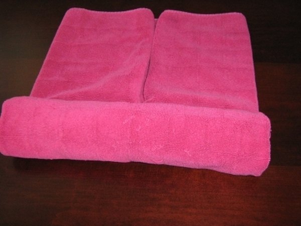 Roll the sides toward the center (both).