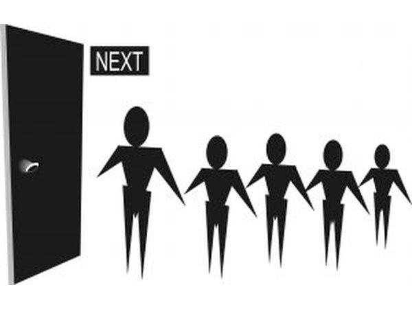 An admissions conselor attends college fairs.