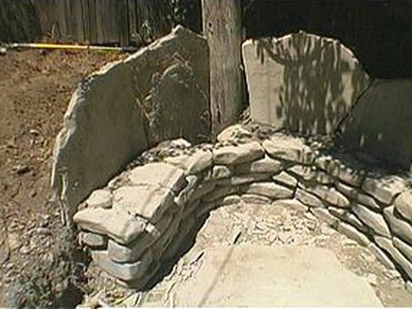 Flagstone slabs should extend 2 feet above the base.