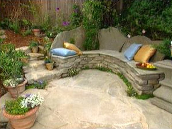 A stone bench blends with nature.