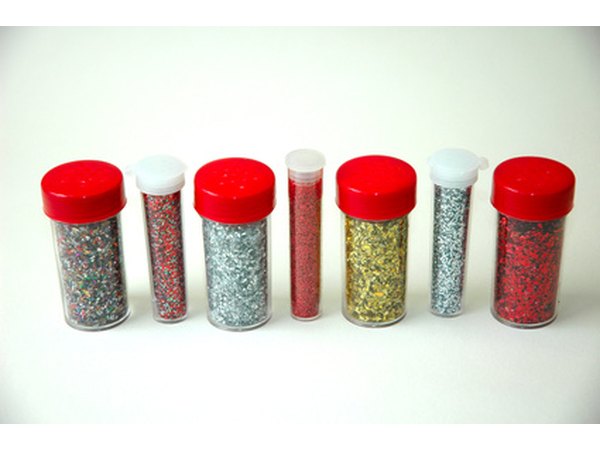 The appearance of braces or cavities can be added using white glue and glitter.