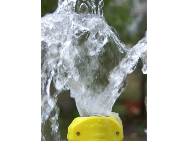 Rinse off the teak with a garden hose.