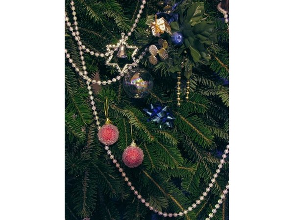 Place lights on the tree before decorating with ornaments.