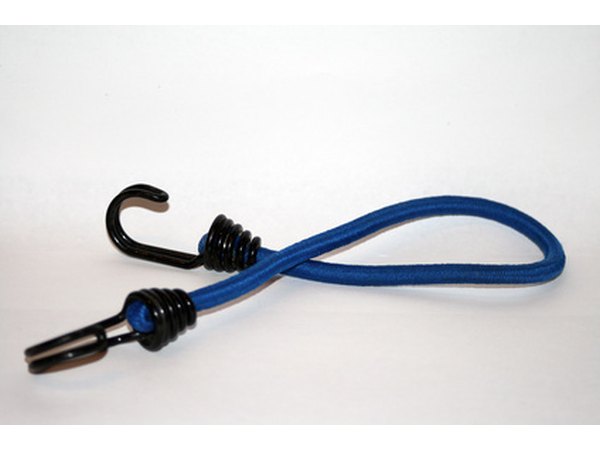 Bungee cords can be used to create shelf dividers.