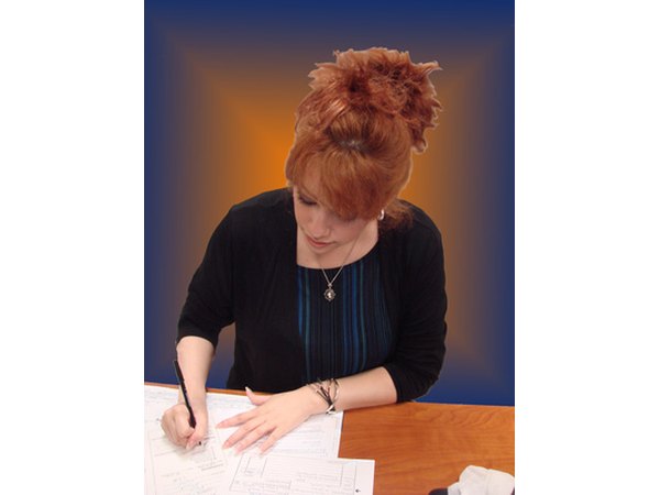 Woman writing a grant.